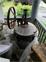 Antique metal washing machine on stand