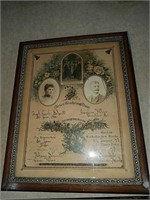 1889 marriage certificate framed with pictures of