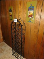 Metal wine rack and 2 wine wall plaques on wall,