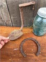 Cast iron buggy step and old horse shoe