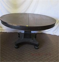 Banded flame mahogany 48" tilt top table on