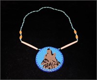 Indian beaded necklace with wolf design, signed