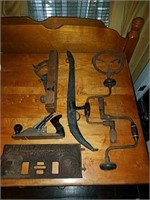 Collection of old tools and cast iron items