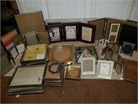 Whole bunch of picture frames that appear to be