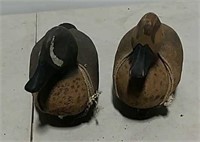 two duck decoys carved by Mike Manos
