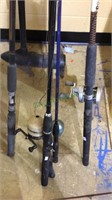 Group of 5 fishing rods with three fishing reels,
