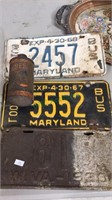 Three vintage license plates, and a cone top