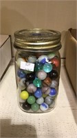 Small jar of vintage glass marbles , including