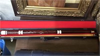Two part pool stick in the original travel case