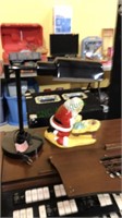 Black desk lamp and a ceramic figure of Santa
