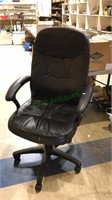 Black leather like office chair with arms, on