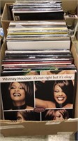 Box of record albums including Whitney Houston