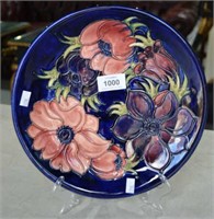 Moorcroft pottery plate, 'Anemone' pattern, on a