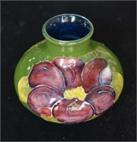 Moorcroft pottery vase 'Clematis' pattern on a