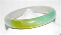 Solid jade bangle, in a multi-coloured hue, inside