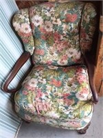 Antique open arm chair with floral upholstery