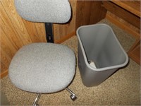 Office chair and trash can.