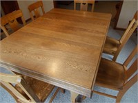 Outstanding Oak dining room table with 11 chairs.