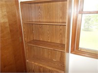 Bookcase with doors on bottom.