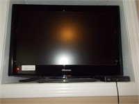 Hisense TV with stand.