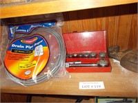 Socket set, small snake, pipe wrenches.