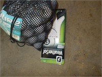 Lot of  golf balls and new golf glove.