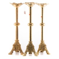 Three large ecclesiastical candlesticks