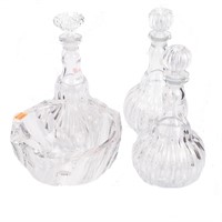 Three crystal decanters and bowl