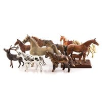 Large assortment of metal horse figures