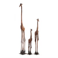 Three native carved wood giraffe figures