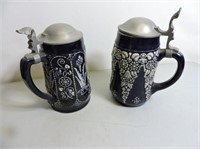 Pair of antique steins with pewter tops
