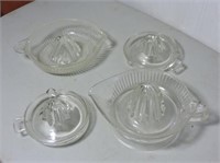 Four clear glass juicers