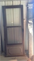 Glass storm door with screen and