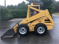 "Tangerine" New Holland L555 skid steer