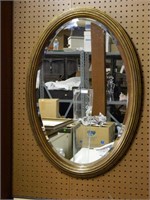 Wood Framed Oval Beveled Mirror.