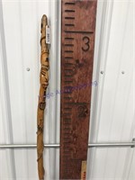 Wood carved cane w/ man face and wrap around, 39"