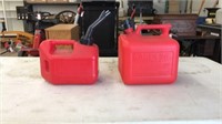 2 gas cans and ice scraper