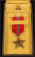 Named WWII Bronze Star medal in coffin case.