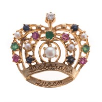 A Lady's Gemstone Encrusted Crown Brooch