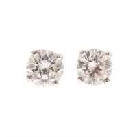 A Pair of Diamond Solitaire Earrings in Platinum