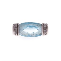 A Lady's Blue Topaz and Diamond Ring in 14K Gold