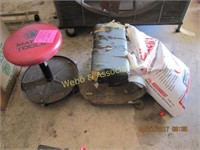 2 mechanic stools on rollers w/ bag of