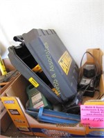 Box of cordless tools and chargers