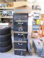 Black metal file cabinet with box of misc