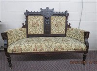 Victorian tapestry upholstered settee on casters