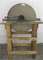 Primitive hand crank grinding stone with stand.