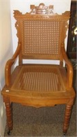 Handcrafted Eastlake style chair with cane seat