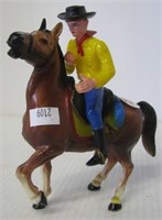 Plastic horse and cowboy combo. Horse is marked