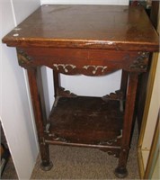 Vintage wood side table with ornate carved