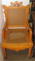 Handcrafted Eastlake style chair with cane seat